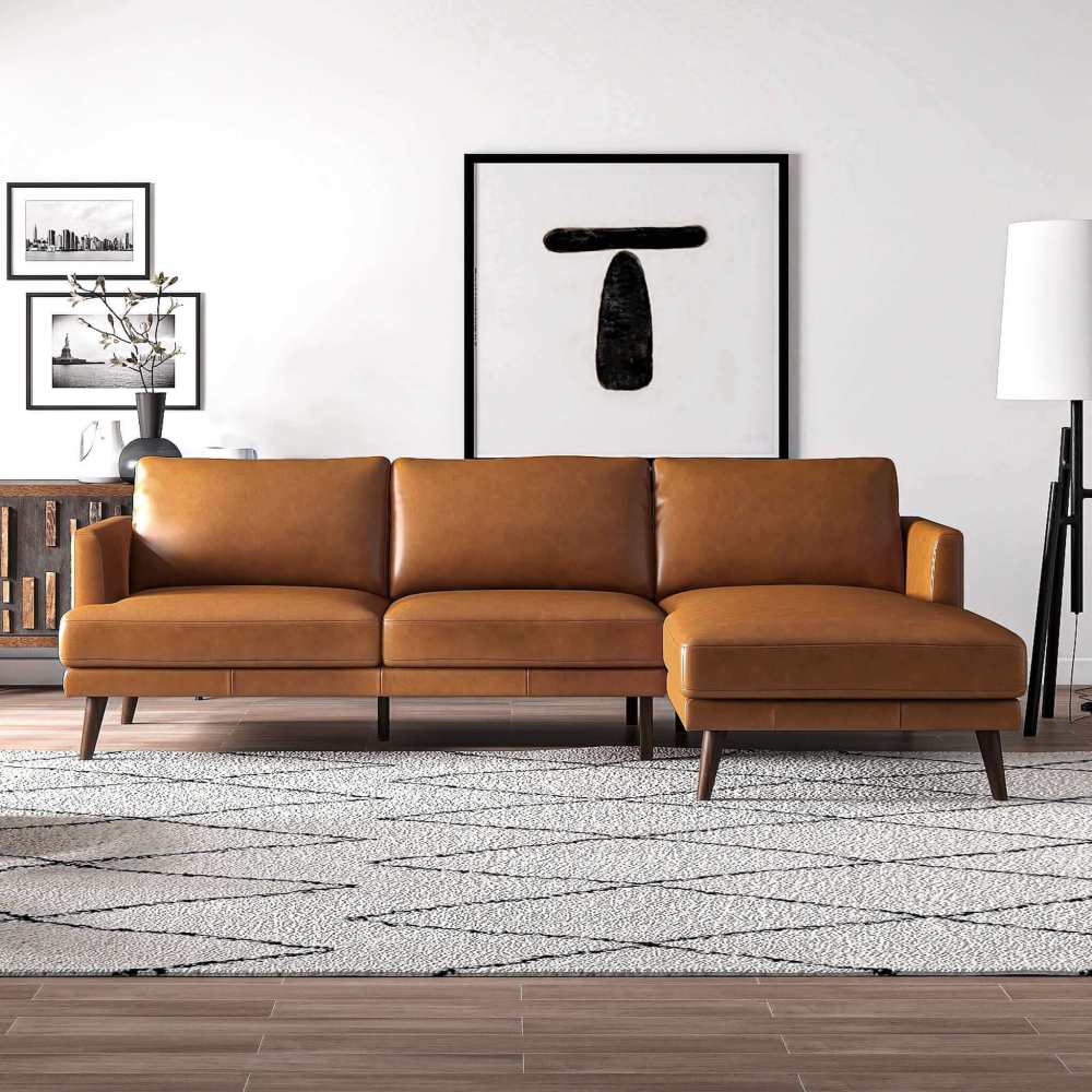 L-shaped genuine leather sectional in tan with mid-century modern design, tapered legs, and cognac walnut finish.