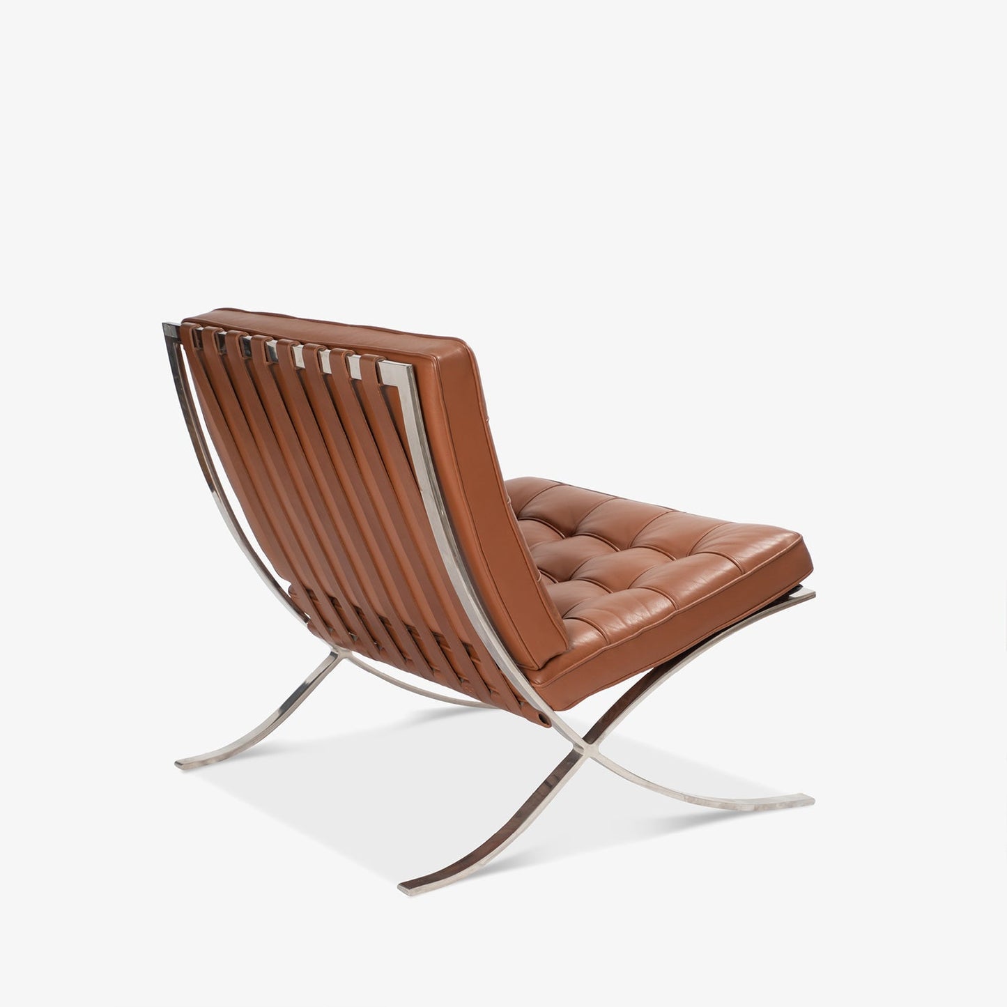 Barcelona Chair in brown leather with chrome stainless steel frame, iconic modern design by Ludwig Mies van der Rohe.