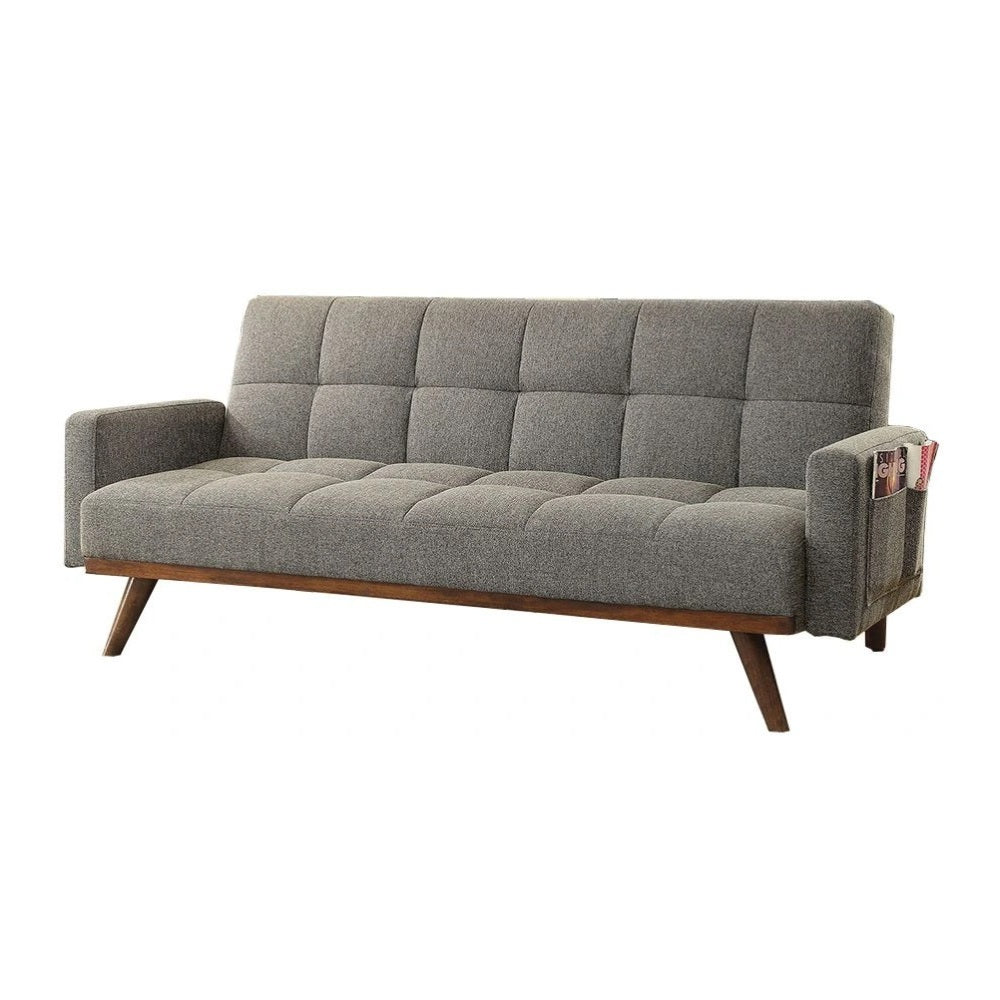 Futon sofa in gray linen, tufted design, converts to bed with angled wooden legs - motivodecor.com