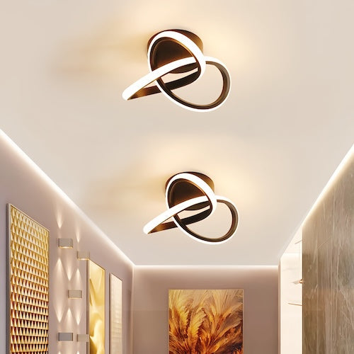 Modern LED ceiling chandelier lamp illuminating a stylish room with elegant design.