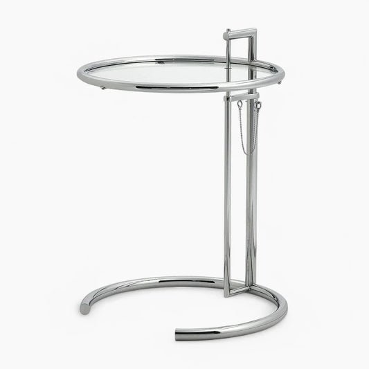 E1027 Side Table with adjustable height, clear tempered glass top, and polished chrome stainless steel frame.