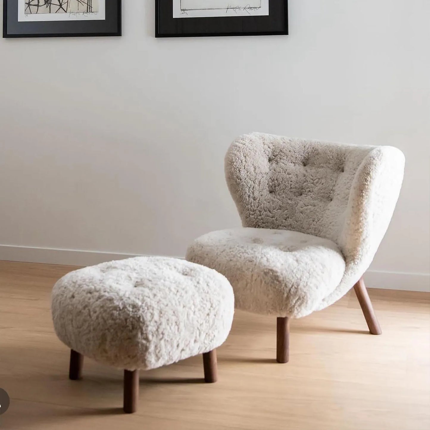 Little Petra Lounge Chair and Ottoman with soft faux sheepskin upholstery and solid wood legs in a minimalist living room setting