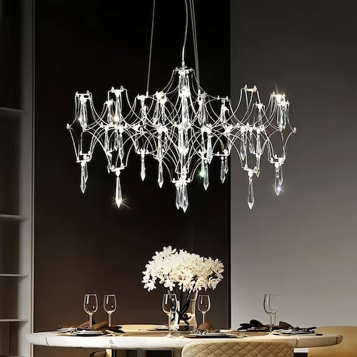 Stylish LED crystal chandelier illuminating a dining area with modern elegance - motivodecor.com