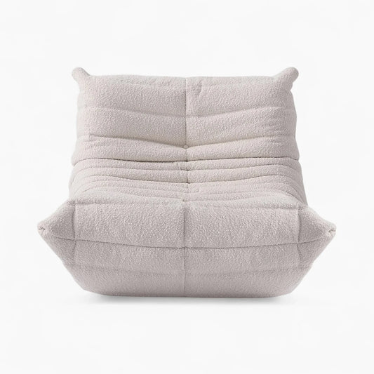 Togo Fireside Chair in light bouclé fabric with ergonomic, low-slung design and channel tufting by Michel Ducaroy for Ligne Roset