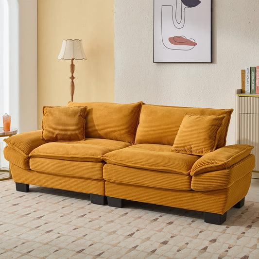 Stylish sofa and loveseat set with pillows, featuring plush corduroy upholstery and sturdy construction, perfect for living rooms and apartments.