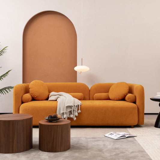 Luxury modern chenille upholstered couch in living room with minimalist design and wooden accents.