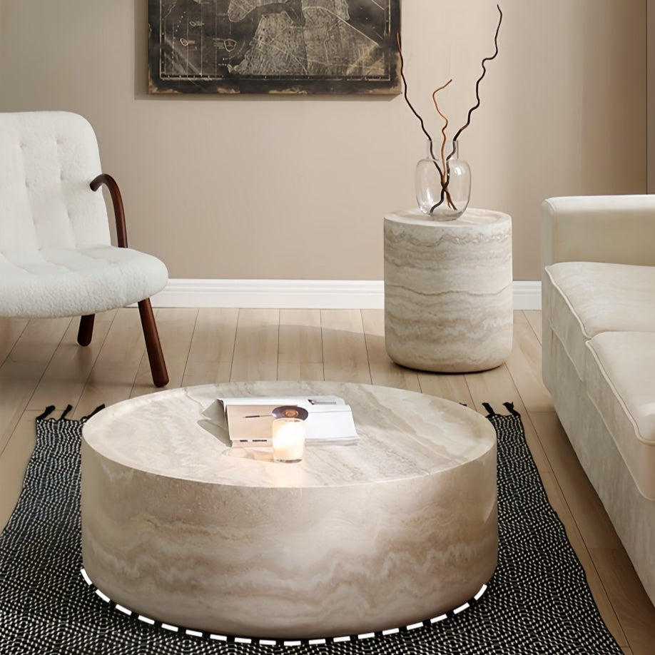 Round marble coffee table in modern living room setting with neutral tones - motivodecor.com