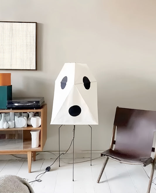 Floor Lamps For Living Rooms, a sculptural white fabric shade with bold black circular cutouts and a slim metal tripod stand.