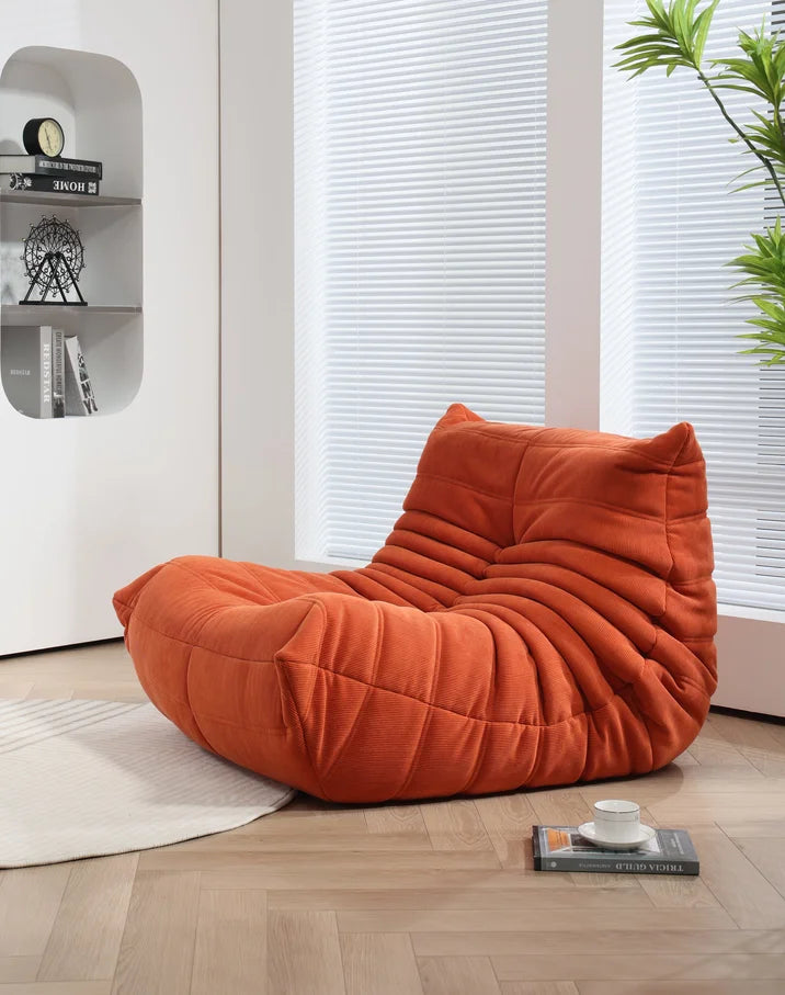 Modern orange corduroy Togo sofa set with view of mountains - motivodecor.com