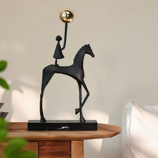 Minimalist modern sculpted black and gold horse decoration with cast aluminum body and marble base for entryway or office