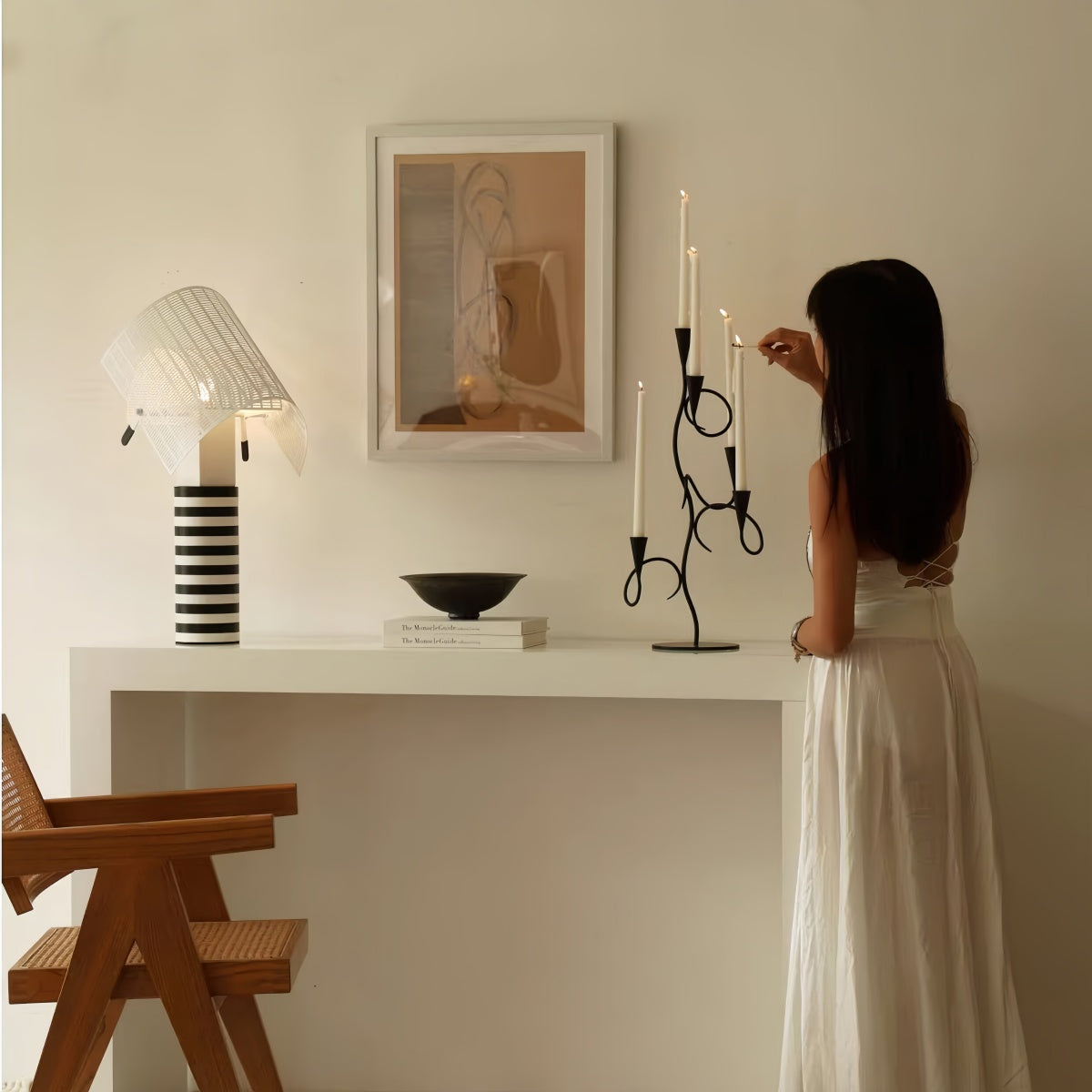 Matte black iron scented candle holder on vintage dining table setting
