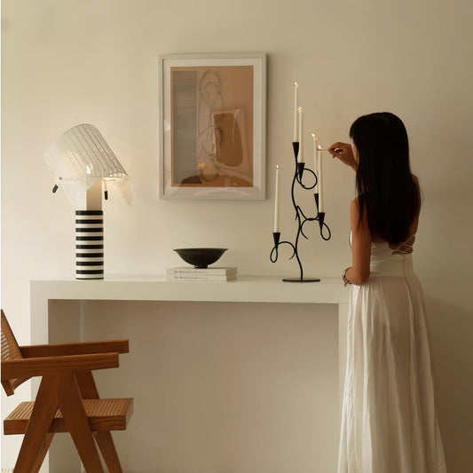 Matte black iron scented candle holder on vintage dining table setting