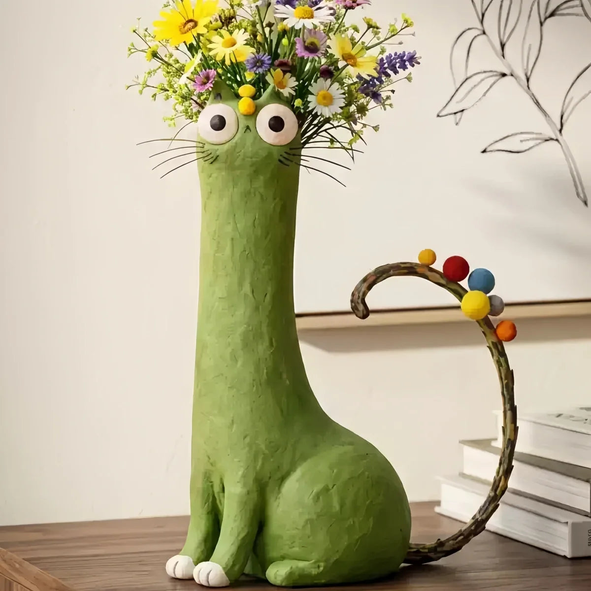 Cat-Themed Vase in playful green resin with whimsical eyes, colorful round tail accents, holding fresh flowers as decor.