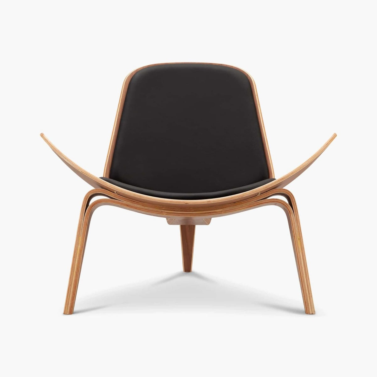Shell 07 Chair with wing-like floating design, leather upholstery, and three-legged wood frame