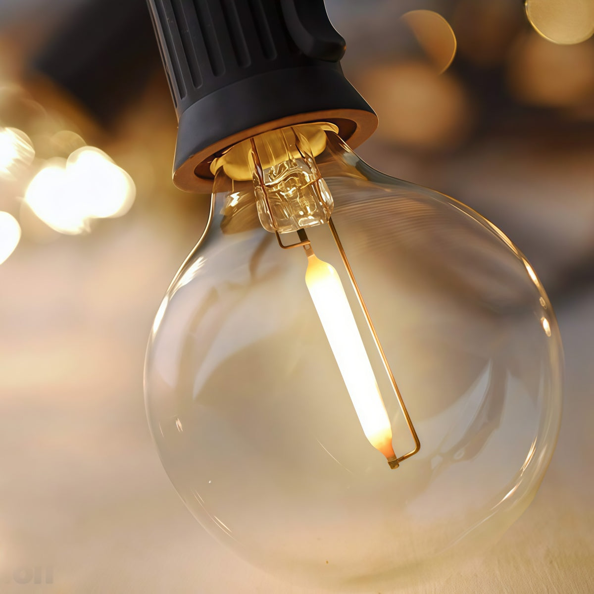 Outdoor LED solar string lights hanging on a tree with warm white bulbs in a garden setting, waterproof and shockproof design.