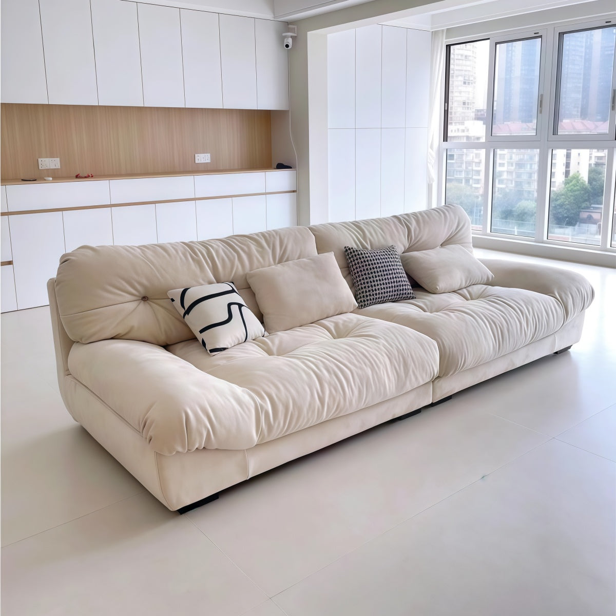 Cloud-themed French cream cream-style L-shaped sofa set in small apartment living room with frosted fabric and plush cushions