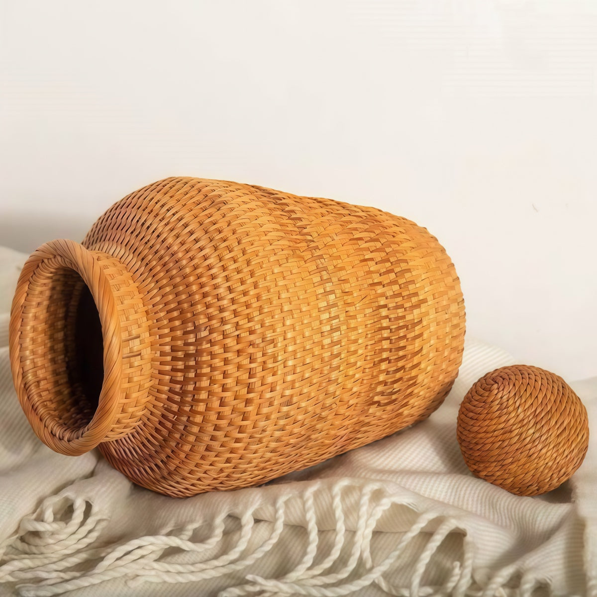 Vine woven vase handmade from natural rattan for home decor and flower arrangement