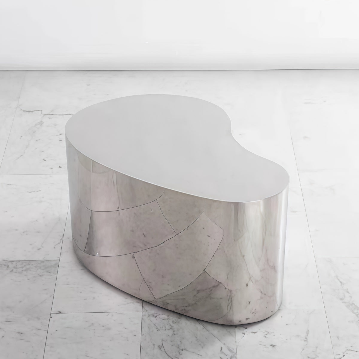 Nordic minimalist stainless steel irregular-shaped island countertop table with brushed finish in modern living room setting