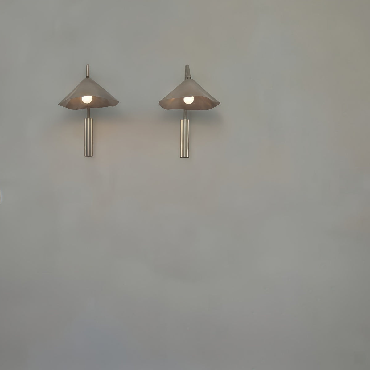Antica Wall Lamp with Spanish Bauhaus mid-century design, aluminum forged body, warm layered LED light for living rooms, studies, and bedrooms