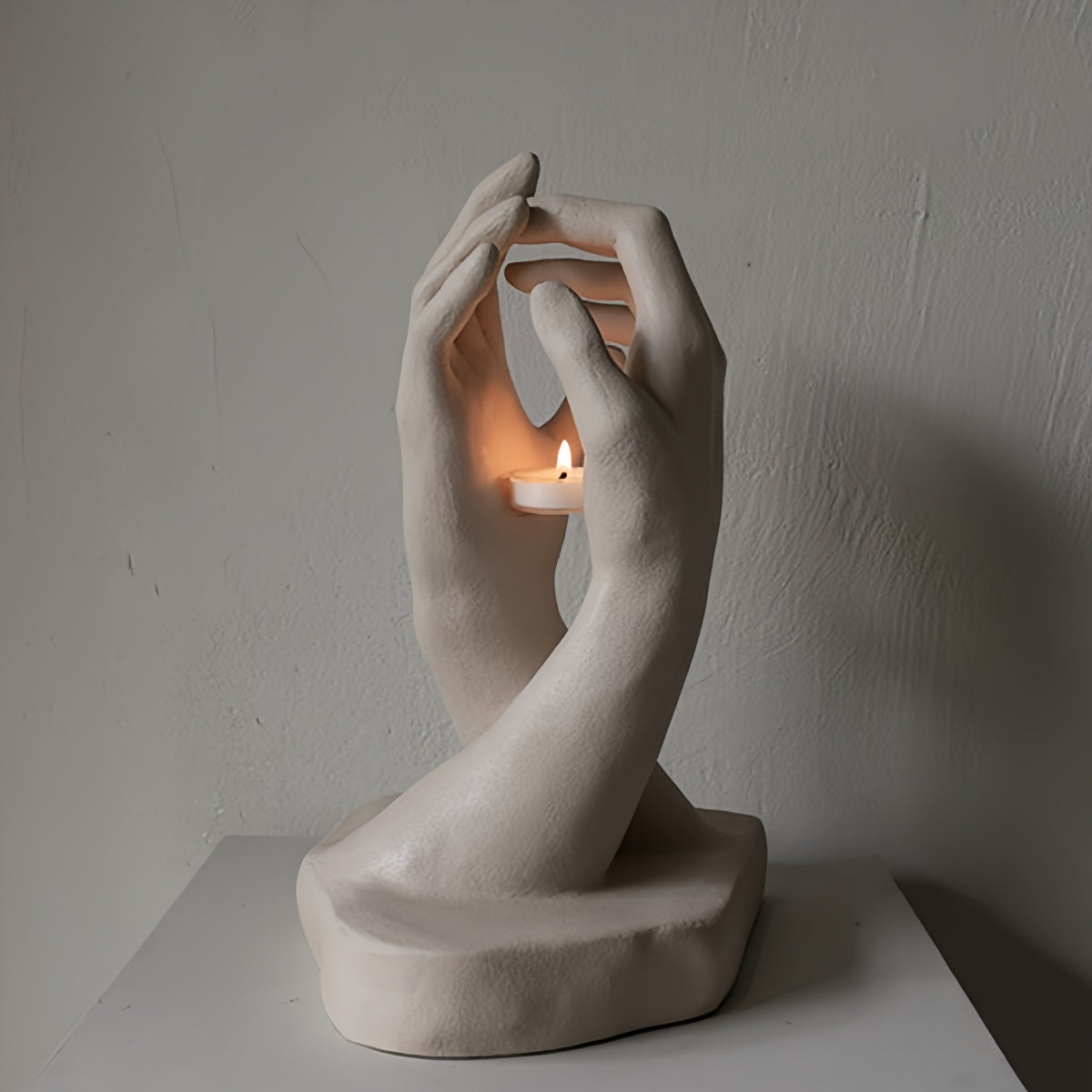 Handmade creative candlestick with two hands reaching, vintage art style, organic resin texture, French style block candle holder
