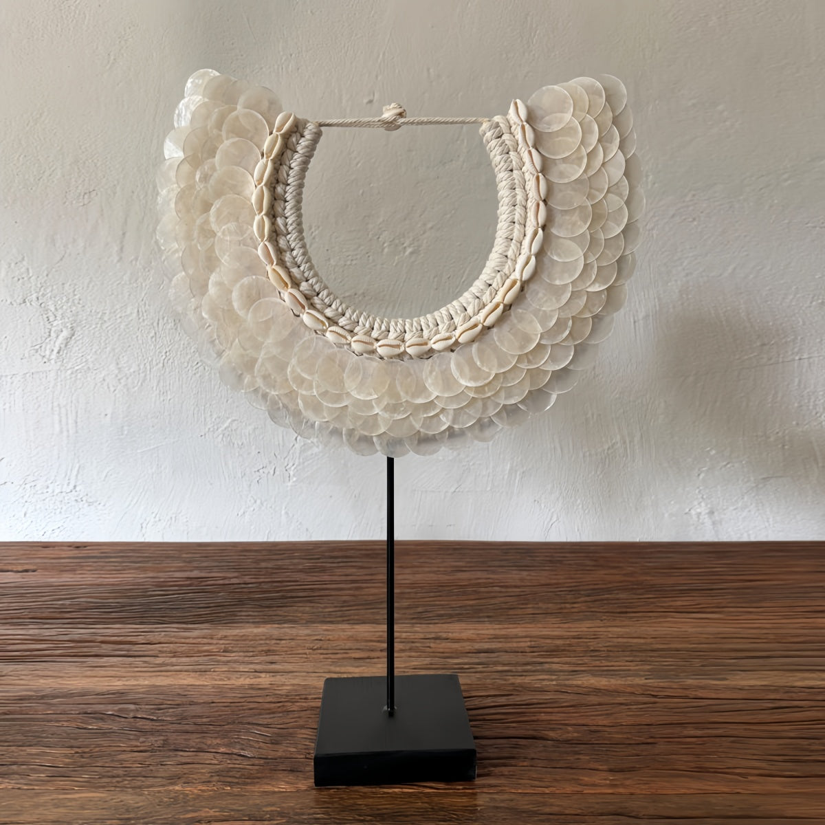 Bali handmade natural shell desktop decoration with shells, cotton thread, wood, and wrought iron in guesthouse entryway