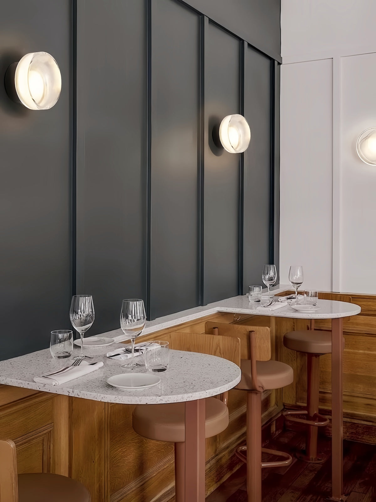 Modern minimalist round LED wall lamp with soft ambient lighting and glass design