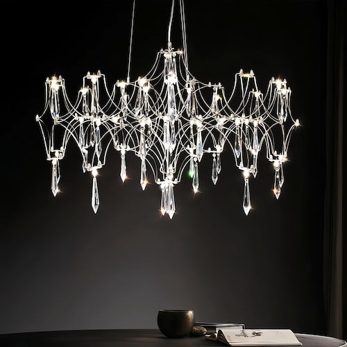 Stylish LED crystal chandelier illuminating a dining area with modern elegance - motivodecor.com