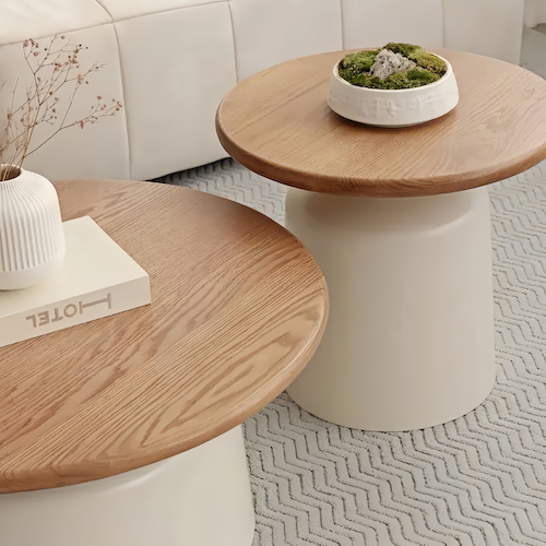 Round oak coffee table with minimalist design and off-white finish, perfect for modern living spaces.