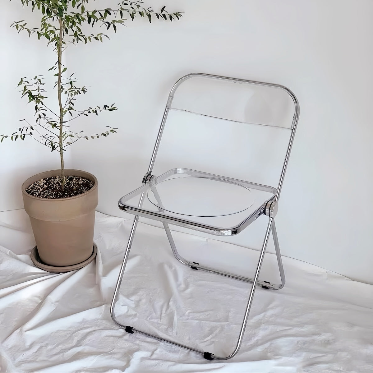 Dining Chair: Transparent Folding Acrylic Chair for Modern Spaces
