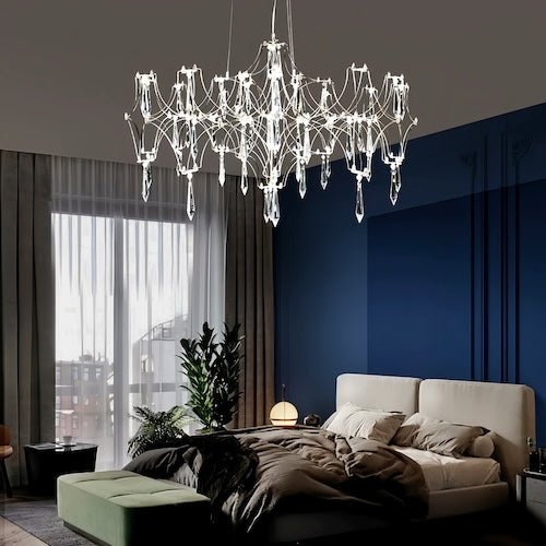 Stylish LED crystal chandelier illuminating a dining area with modern elegance - motivodecor.com