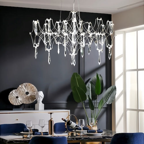 Stylish LED crystal chandelier illuminating a dining area with modern elegance - motivodecor.com