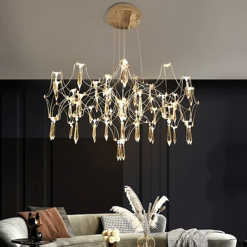 Stylish LED crystal chandelier illuminating a dining area with modern elegance - motivodecor.com