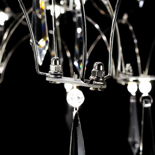 Stylish LED crystal chandelier illuminating a dining area with modern elegance - motivodecor.com