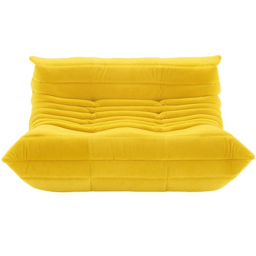 Ligne Roset Togo yellow sofa with sumptuous suede upholstery and signature curved design.