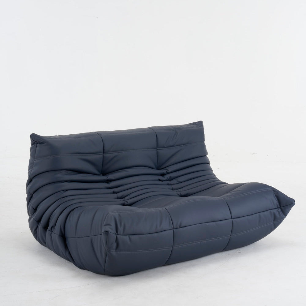 Dark blue cushioned leather sofa - motivodecor.com