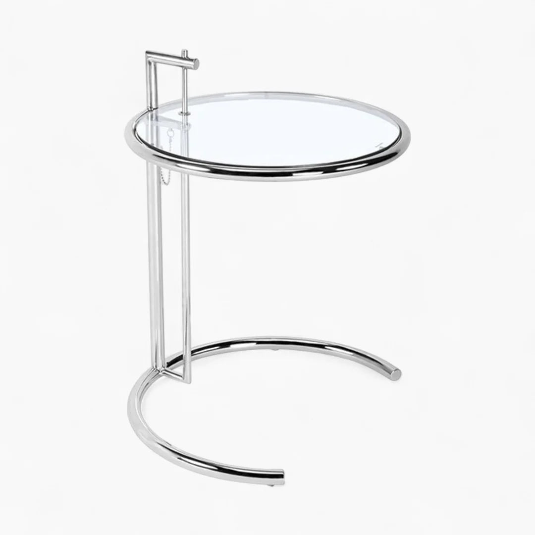 E1027 Side Table with adjustable height, clear tempered glass top, and polished chrome stainless steel frame.