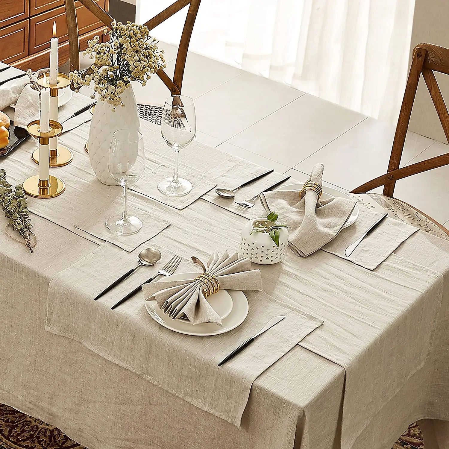 Elegant rectangle tablecloth in beige, enhancing a dining table with stylish decor and table settings.