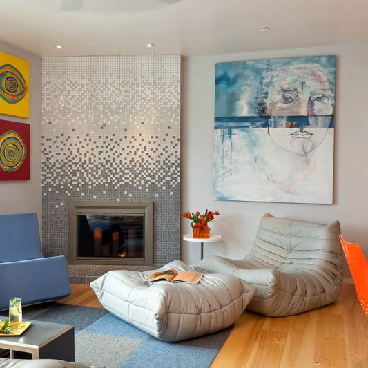 Togo Fireside Chair and Foot Stool in modern living room, suede upholstery, elegant design.