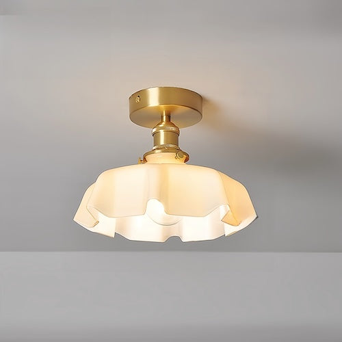 Elegant flush mount ceiling light with milky glass design and copper fixture.