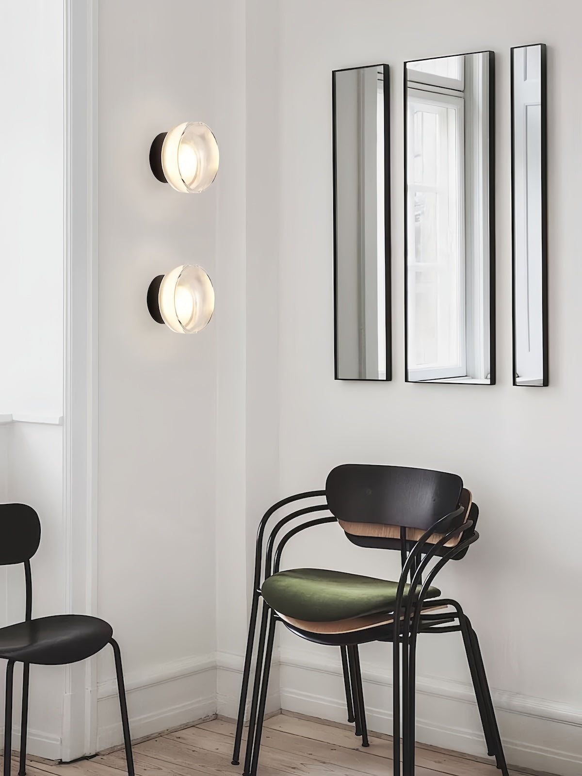 Modern minimalist LED wall lamp with round glass design emitting warm ambient light