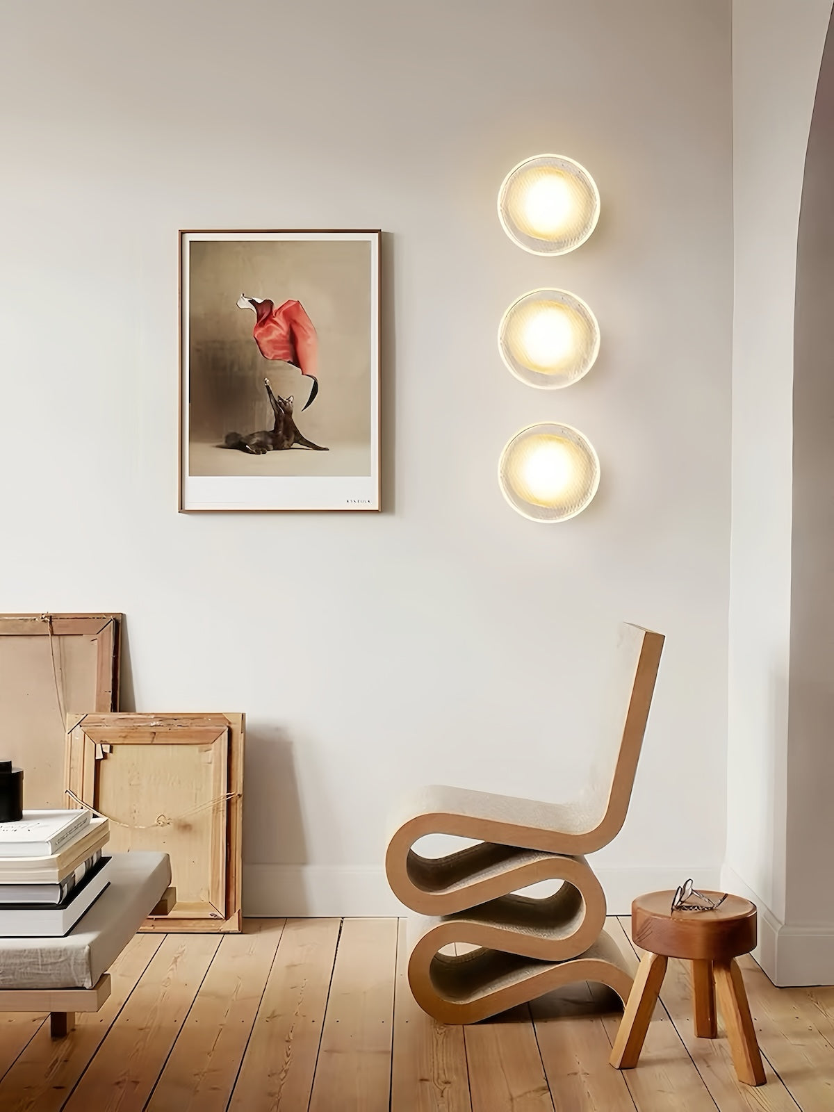 Modern minimalist round LED wall lamp with soft ambient lighting on white wall
