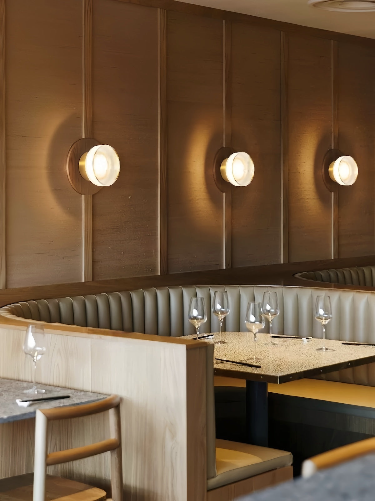 Modern LED wall lamp with round glass minimalist design and warm ambient lighting