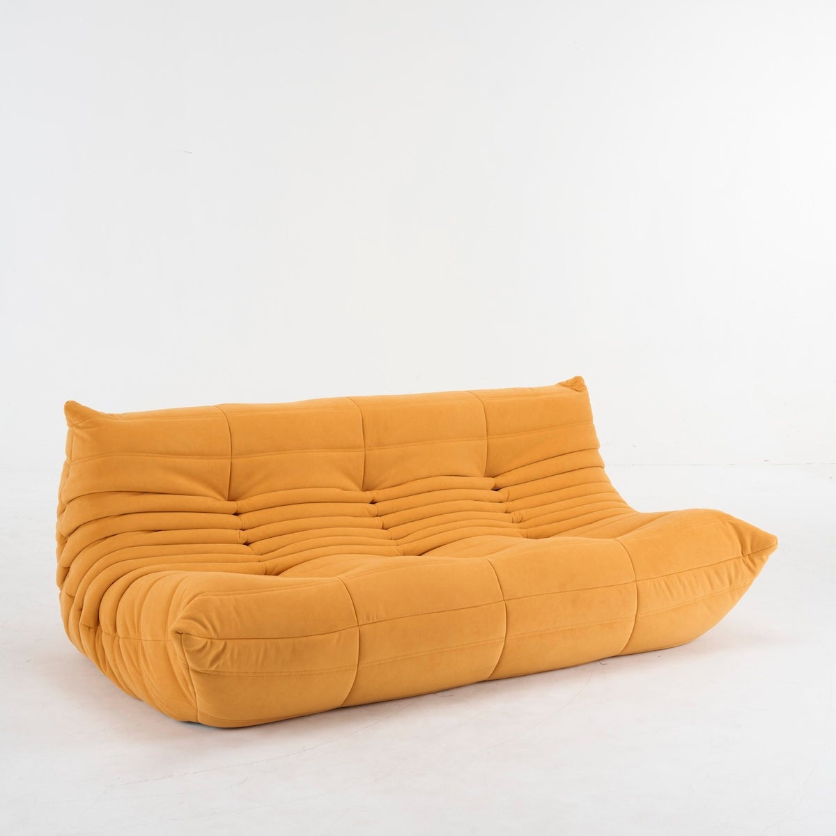 Mustard yellow togo couch in suede