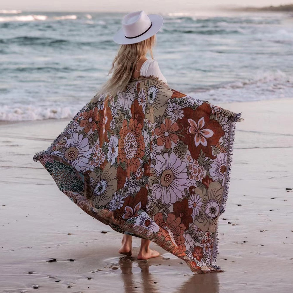 Linen and cotton beach blanket with floral yarn-dyed pattern, perfect for versatile use and easy care.