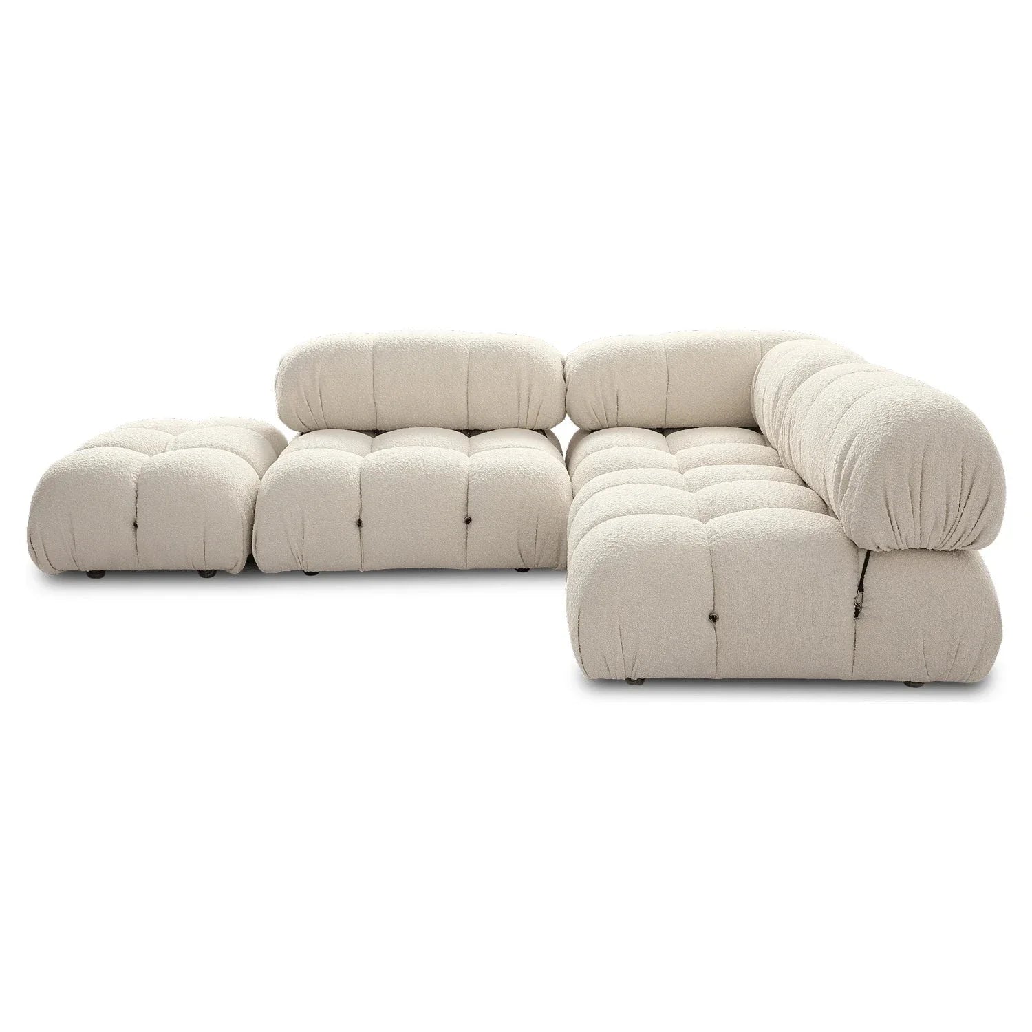 Modular sofa sectional with flexible fabric modules in beige velvet for a customizable living room design.