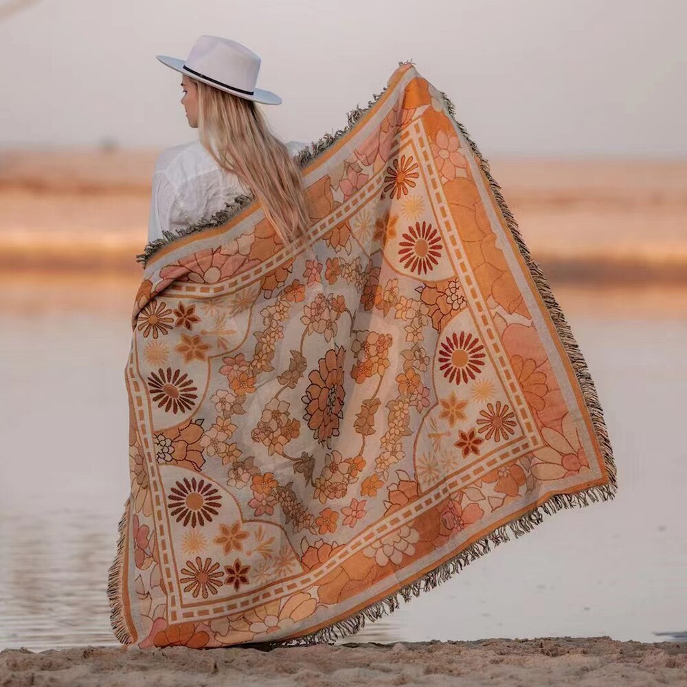 Linen and cotton beach blanket with yarn-dyed pattern by the seaside.