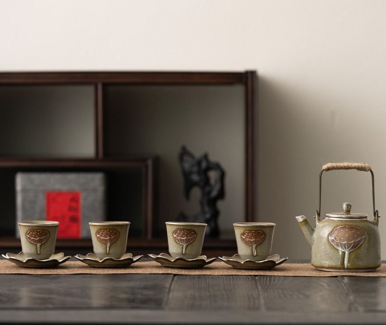 Ceramic tea gift set with teapot and cups, elegant tea-drinking collection.