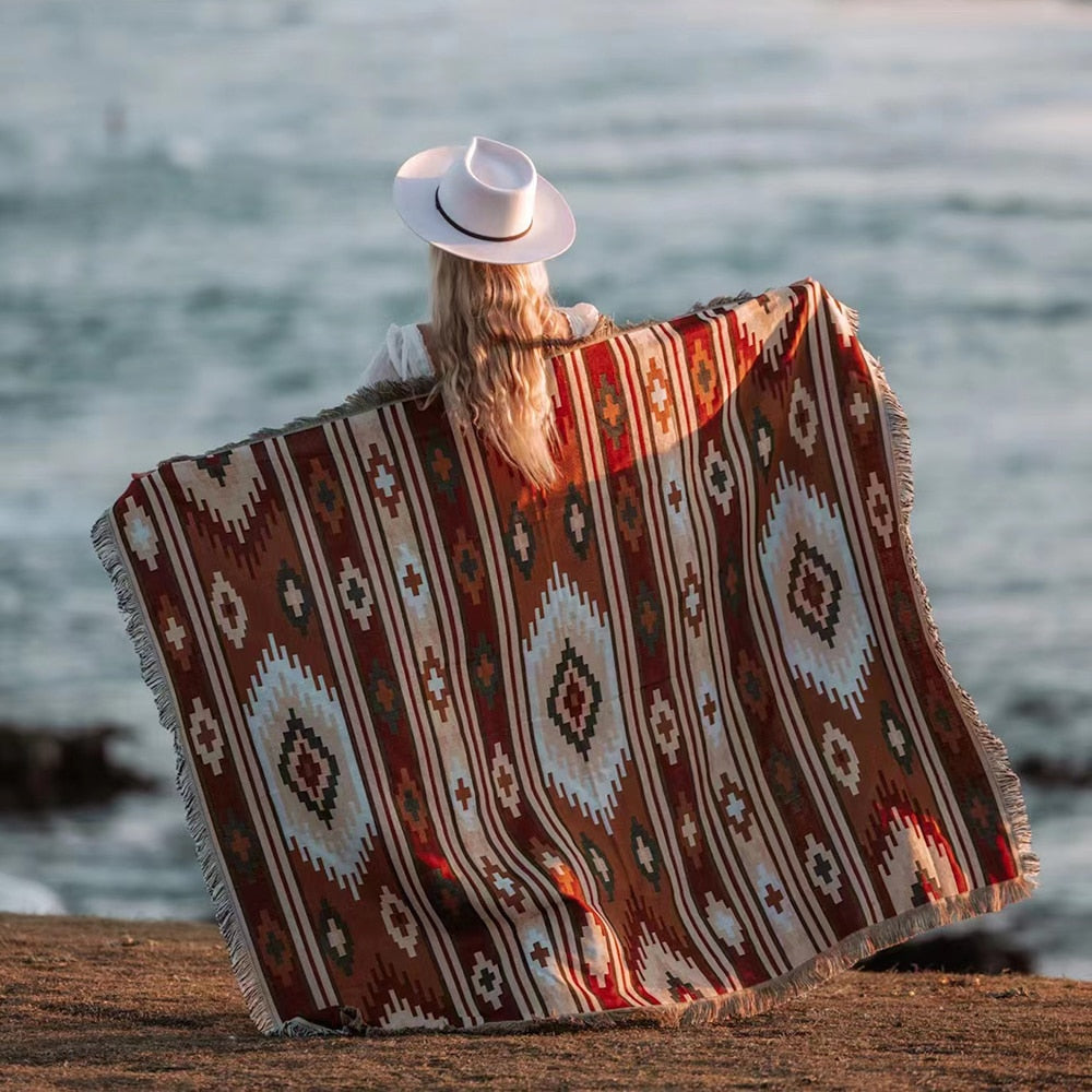 Linen and cotton beach blanket with yarn-dyed pattern at the seaside.