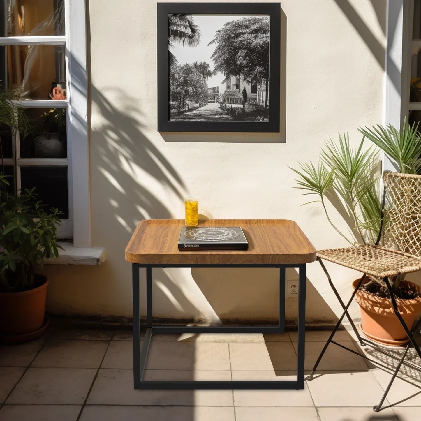 Modern square coffee table set with walnut wood top and black metal base in a stylish room setting.