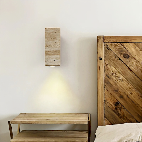 Travertine stone wall light, Zen aesthetic, natural luxury, gentle ambient lighting, bedroom decor.